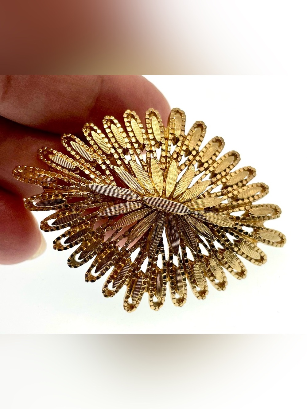 Vintage Monet Gold Tone Openwork Sunburst Floral Brooch Signed 1970s